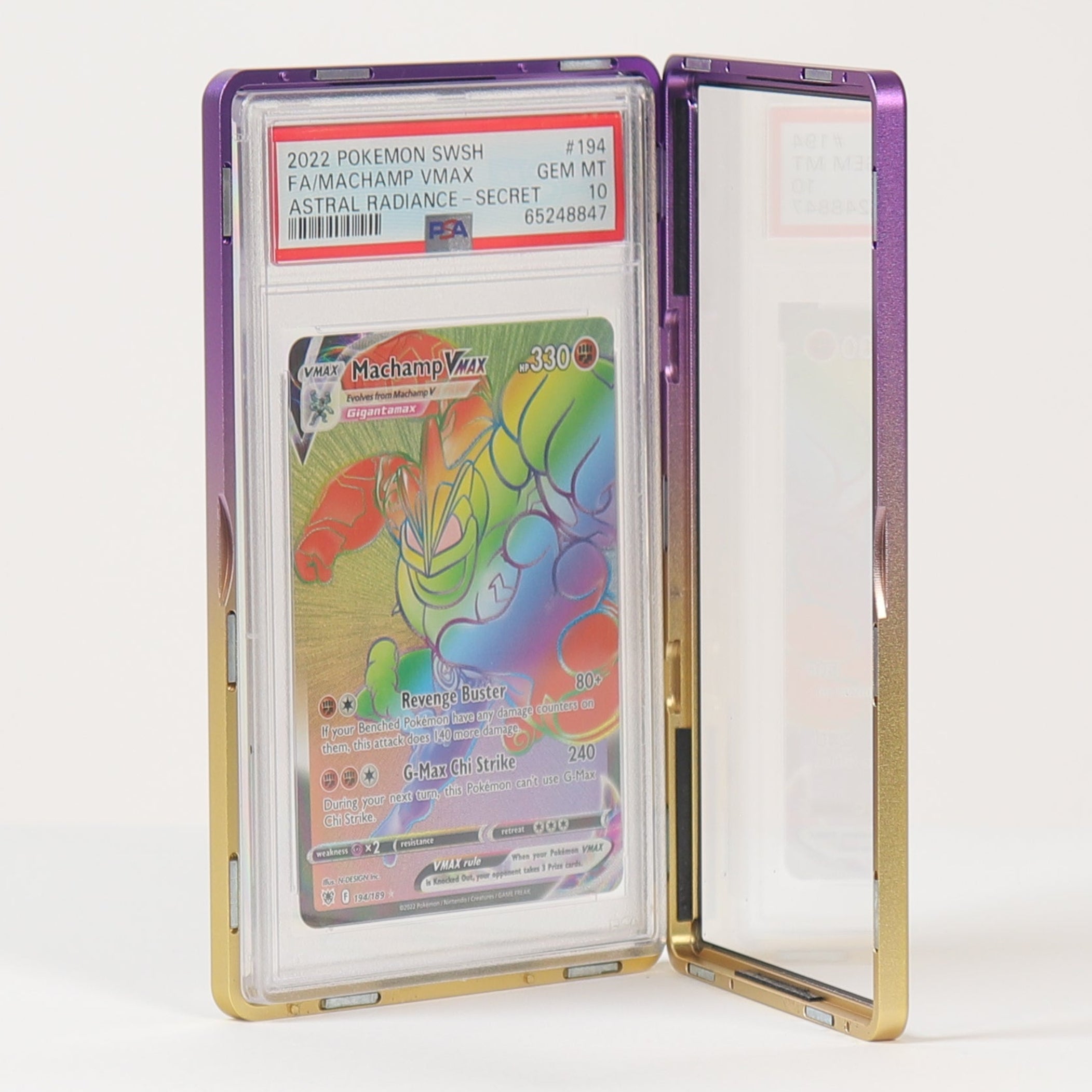 A PSA-graded holographic rainbow card in a clear protective case with a gold-toned frame, standing open on a white surface against a white background.
