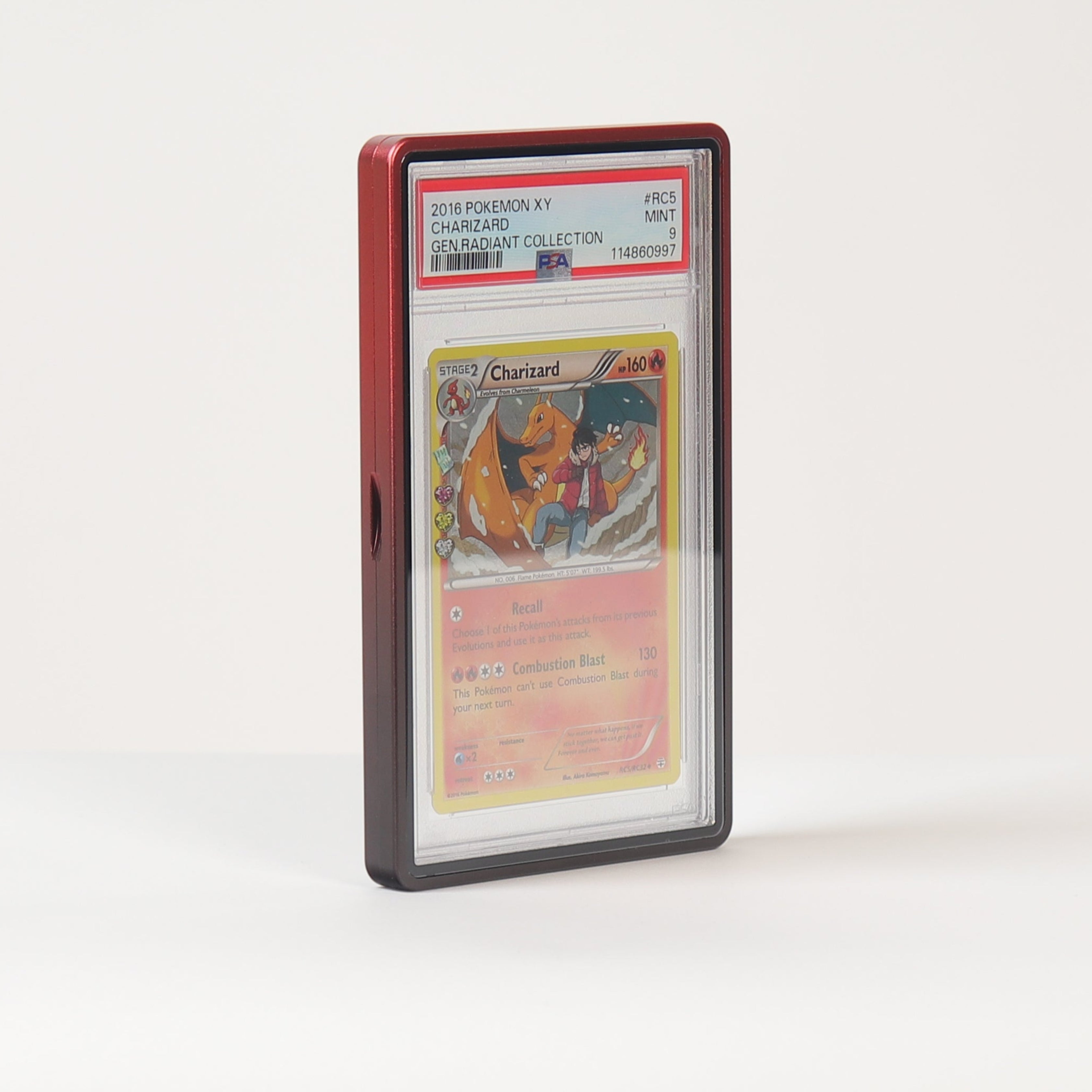 A graded collectible card in a clear plastic slab with a red top border, standing upright on a white surface against a white background.